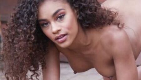 Latina babe stripping on a hood outdoor