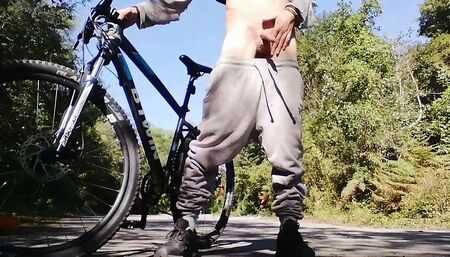 Young man playing with his bike with dildo in his ass