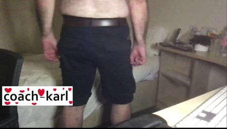 Coach Karl shows off his blue shorts