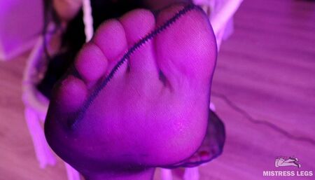 Teasing feet in black sexy stockings