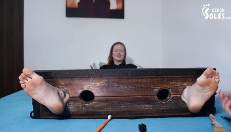 Merciless tickling of her big bare feet