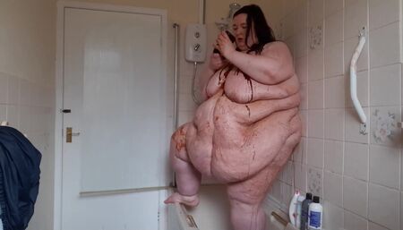 Ssbbw body covered in chocolate sauce in shower