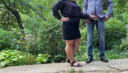 Mommy holds stepson's cock while he pisses outside