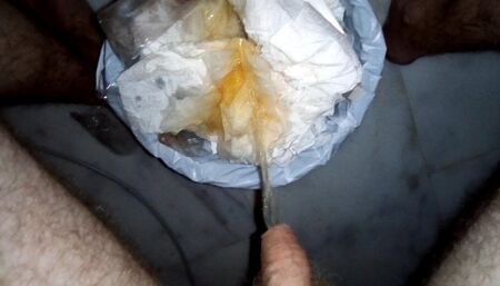 John is waking up and Pissing into the Trashcan