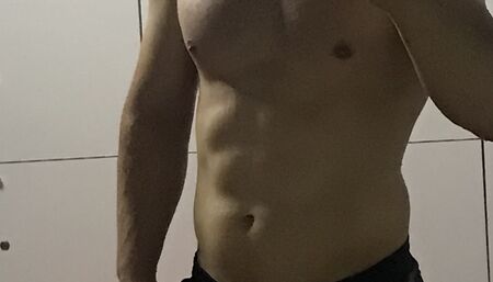 Sexy man taking a shower