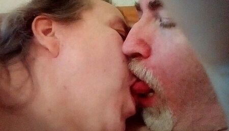 Jen and John are kissing in closeup