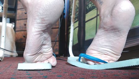 Filthy blue flip flops worn out