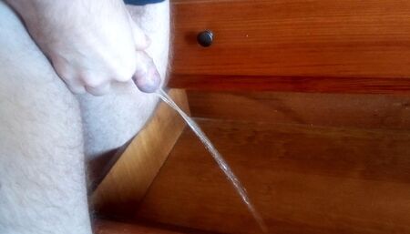 John is pissing it all into the drawer