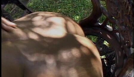 Hot busty African chic gets fucked from behind under a tree