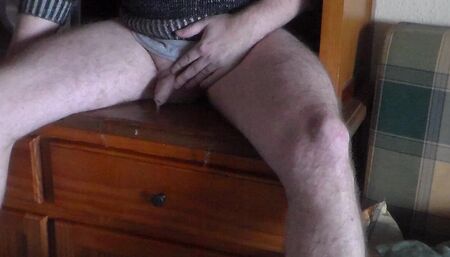 John is pissing all over the bookcase