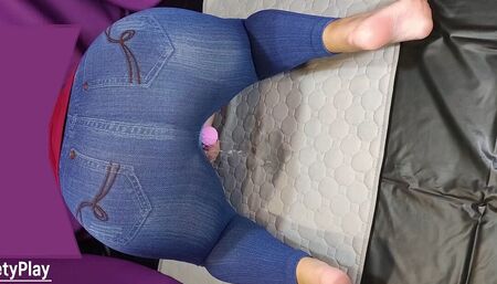 Big ass in jeans peeing with vibrator