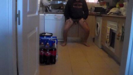 John is pissing all over the kitchen floor