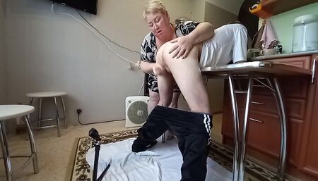 Mother-in-law caught me in the kitchen and jerks off my dick