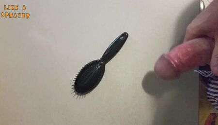 Handjob and cumshot on a haribrush