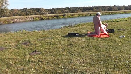 Wild beach. Nudist beach. Lover fucked doggy style blonde Milf on river bank Outdoor. Couple naked in public outside doggy style
