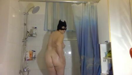 The wild cat is showering