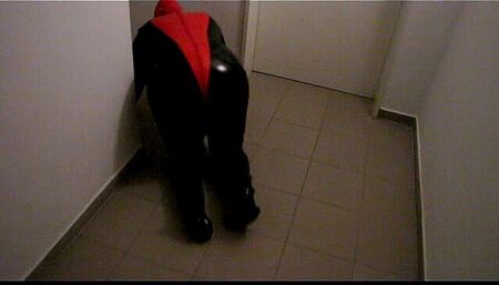 Petplay in latex suit