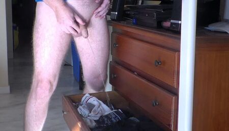 John is peeing all into the underwear drawer