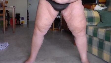 Jen is peeing her panties in the living room