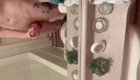 Stroking in bathroom and cumshot