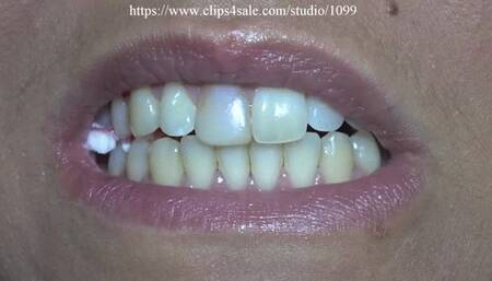 Woman chewing candys close to camera