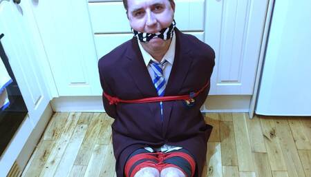 Man in adult school uniform bound and gagged on kitchen floor - cam 1 part 2