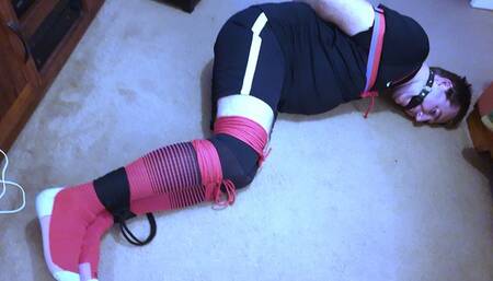 Footballer bound and gagged in black and red kit