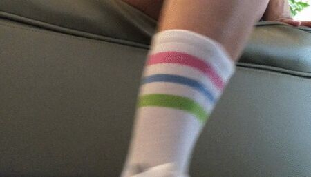 Dasha Kelly is boredand nervous while reading a book she hits hard with her sneakers on the floor she wears hot pants