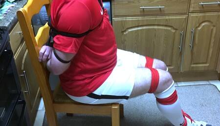 Footballer bound and gagged tight struggling on kitchen floor and made to cum