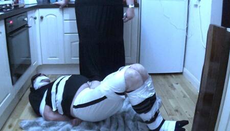 Taped up footballer on kitchen floor given a post orgasm handjob by BBW