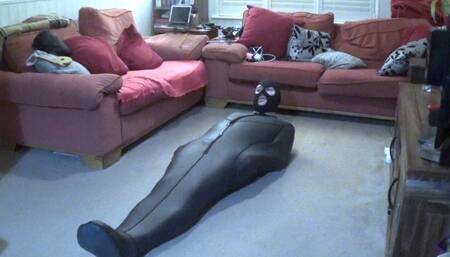 Man in neoprene sleepsack trying to get free