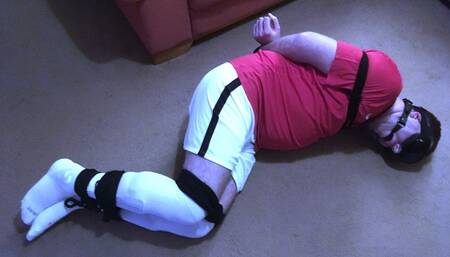 Post orgasm torment on a footballer bound and gagged on floor