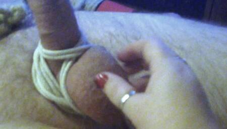 Close up handjob on man tied to bed 1