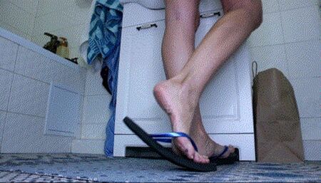 Black flip flops in bathroom