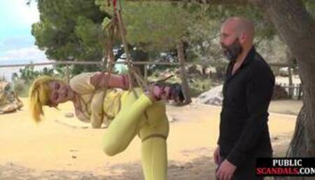 Femsub used in public suspension bondage with spanking