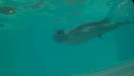 Twink loses trunks in hotel pool and swims naked