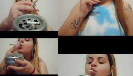 seductively smokes a 120s all white cigarette for you in up close view!