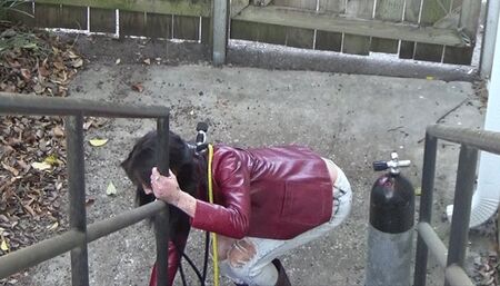 SCUBA Diver Dakota, in 1980s Leather, Smokes and Carries Her Air Tank