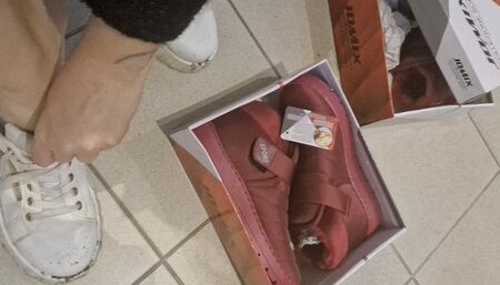 Dirty sneakers dirty feet in a public store 4K