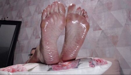 Big Feet covered with baby oil