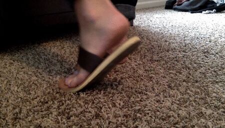 feet in brown sandals, slides