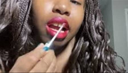 Giantess unaware that she is being watched by tiny human as she puts on makeup