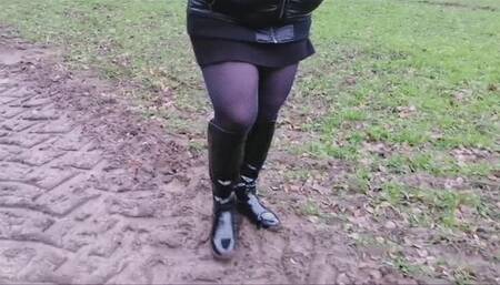 Boots, mud and miniskirt