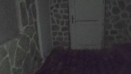 Outdoor piss neighbours's door with spit