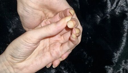 Long natural nails on dark tedy bear