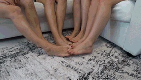 4 gerls crossed legs and interlocking their toes together d