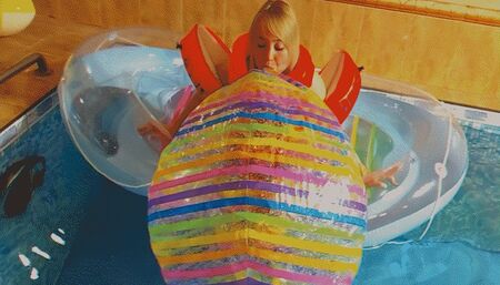 Alla inflates a large rare beach ball with her mouth and floats on an inflatable boat in the pool!!!