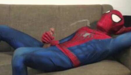 Horny Spiderman jerks off and cums massive load