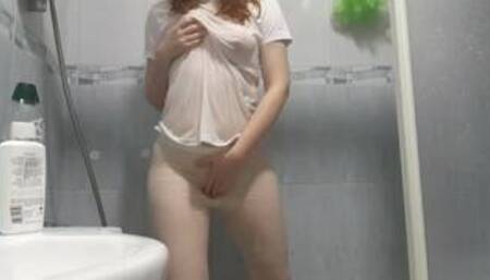 Little Redhead takes a hot clothed shower then cums hard