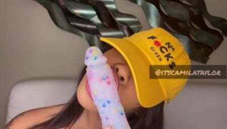 Camila Taylor looking pretty while sucking confetti dildo